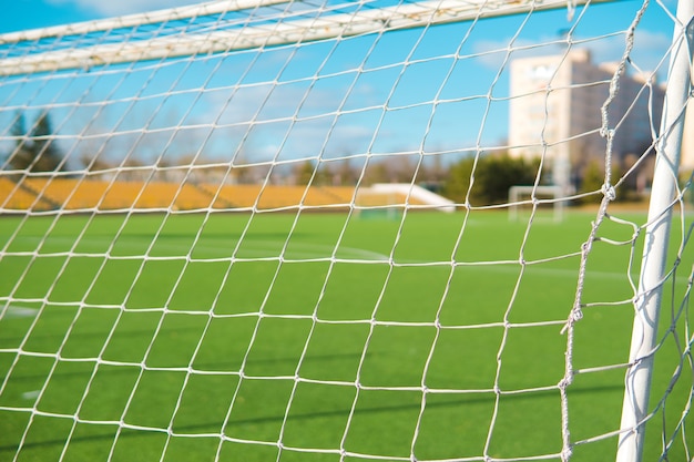 Football goal on a empty field due to a coronavirus