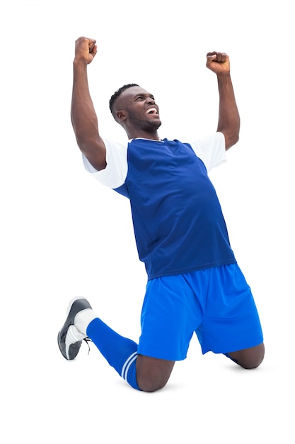 Football player in blue celebrating a win