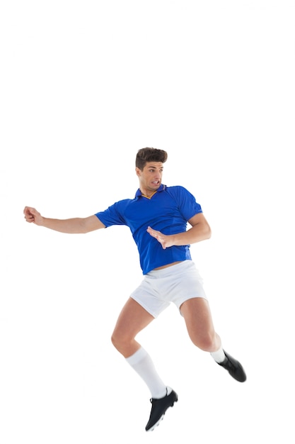 Football player in blue jersey jumping