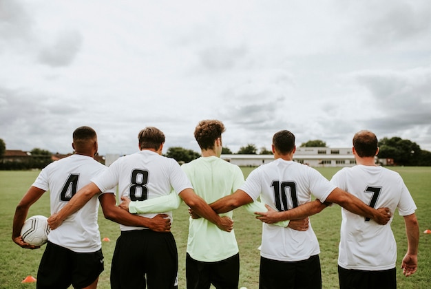 Football players standing together side by side