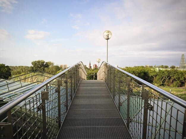 Footbridge against sky