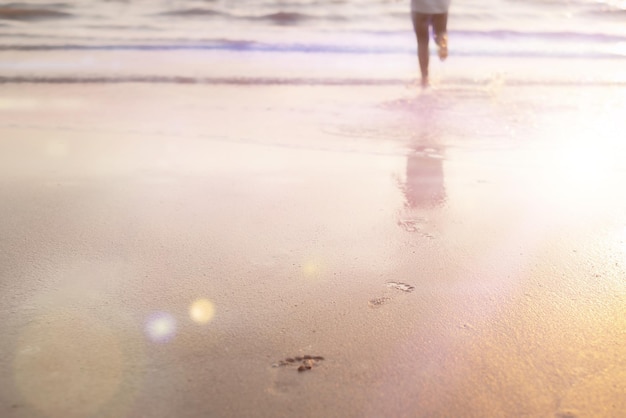 Footprints in the sand from a child