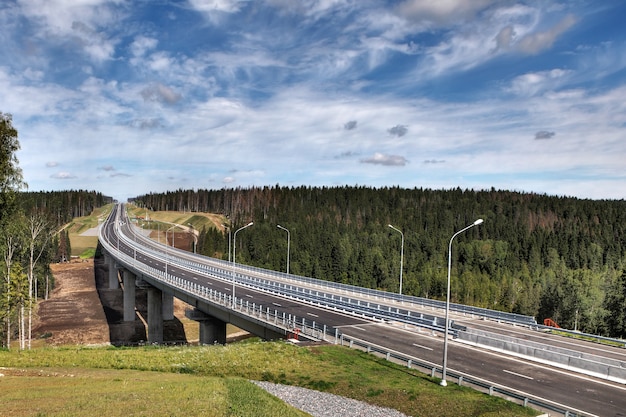 Forest road and unfinished bridge.