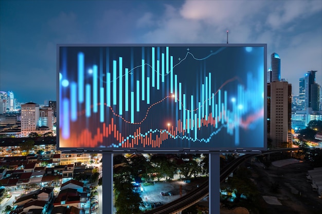 FOREX graph hologram on billboard aerial night panoramic cityscape of Kuala Lumpur KL is the developed location for stock market researchers in Malaysia Asia The concept of fundamental analysis