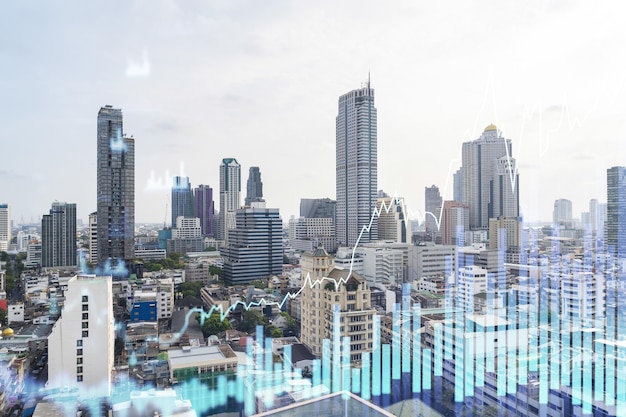 Forex and stock market chart hologram over panorama city view of Bangkok the financial center in Southeast Asia The concept of international trading Double exposure