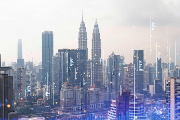 Forex and stock market chart hologram over panorama city view of Kuala Lumpur KL is the financial center in Malaysia Asia The concept of international trading Double exposure