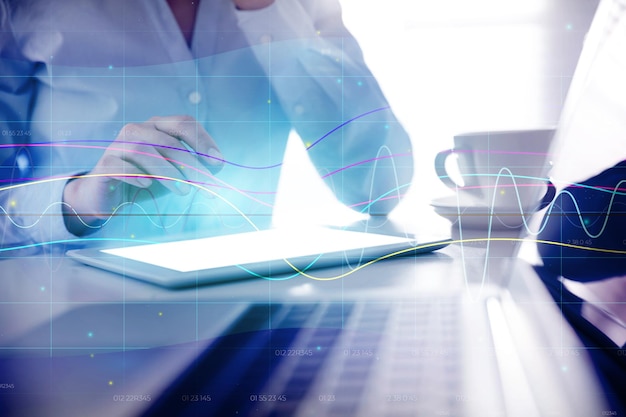 Forex trading Double exposure of charts and woman using tablet computer closeup