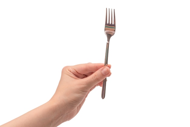 Fork in woman hand isolated on white.