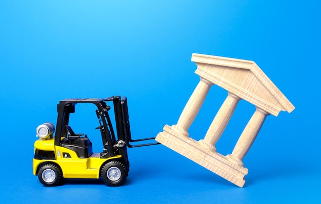 A forklift demolishes a bank building Bankrupt bank liquidation procedure Overthrow of government dismantling of ruling elite Financial system recovery Elimination of the bureaucratized systems