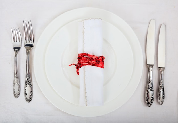 Formal table setting on white background