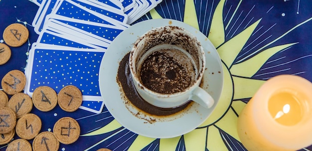 A fortune teller reads fortunes on coffee grounds Selective focus