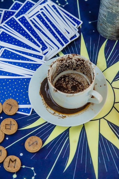 A fortune teller reads fortunes on coffee grounds Selective focus