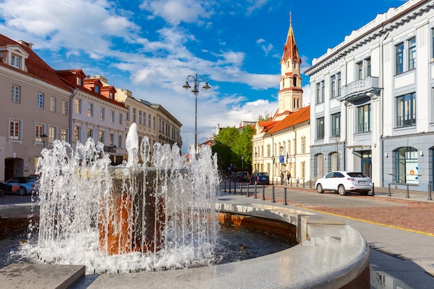 Fountain and church, Old town Vilnius, Lithuania.