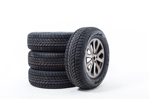 four black tires isolated on white background