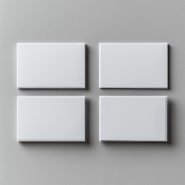 Photo four blank white cards mockup on a gray wall