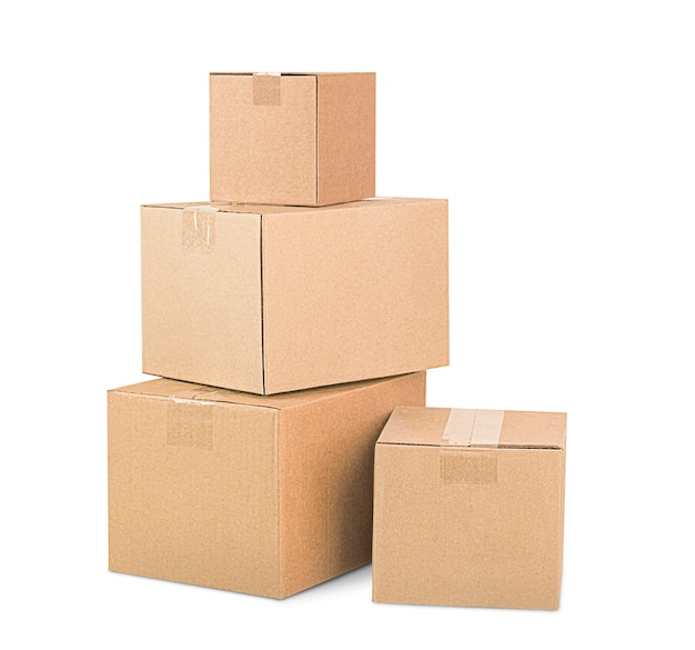 Four cardboard boxes stacked in a pile on white isolated