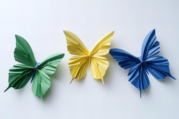 Photo four colorful butterflies are lined up on a white surface