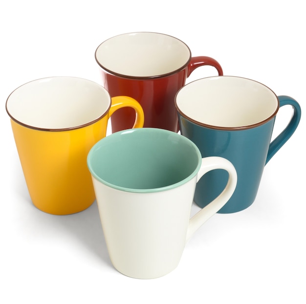 Four empty multicolored ceramic mugs on white