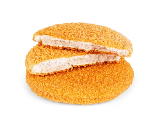 Four frozen chicken cutlets breaded in bread isolated on white background