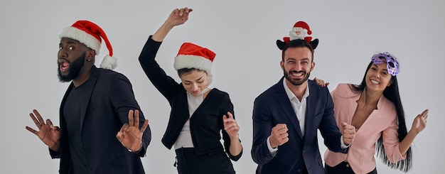 The four happy business people on a christmas party