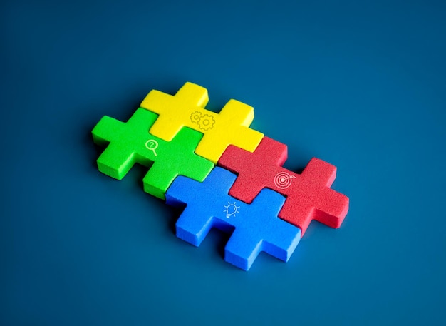 Four jigsaw puzzle blocks different colors with checkmark icon are put together on blue background minimal style Business partnership teamwork difference unity and collaboration concepts