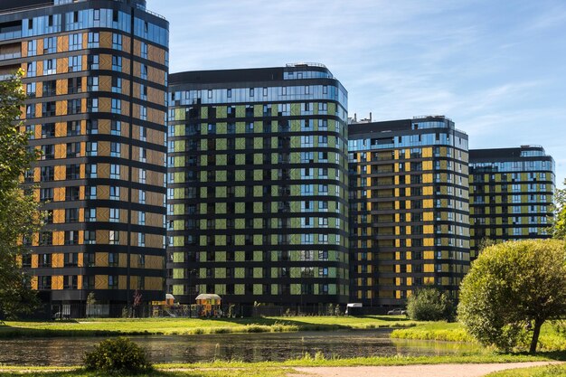 Four multi-storey residential buildings in perspective with multi-colored facades