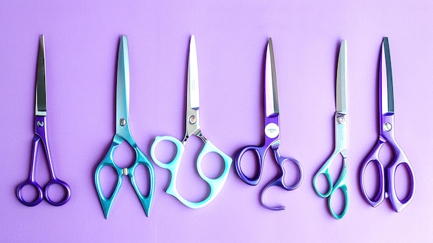 four scissors are lined up on a purple surface