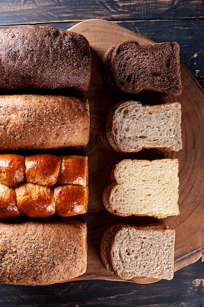 Four varieties of bread together Wholemeal bread brioche chocolate and with chestnuts Top view