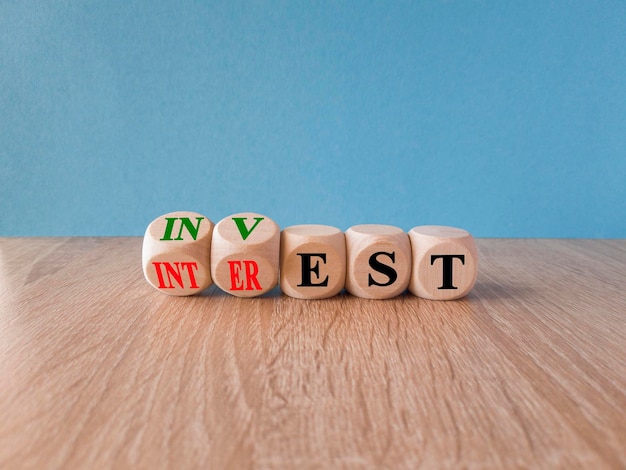 Four wooden cubes with the word intr on them