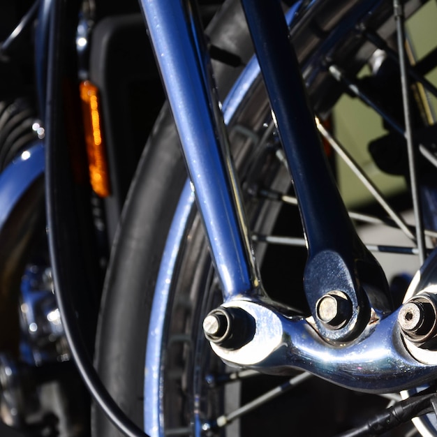 Fragment of chromed shiny wheel of old classic motorbike