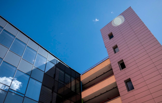 Fragment of the colored facade of a parking building against the sky