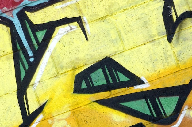 Fragment of colored street art graffiti paintings with contours and shading close up