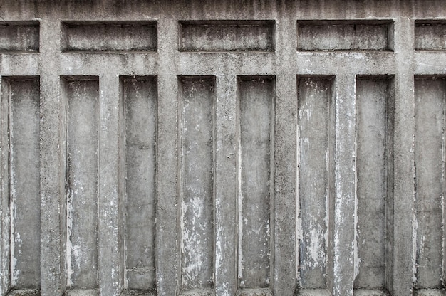 Fragment of a concrete fence Peeling concrete fence Peeling concrete wall Background