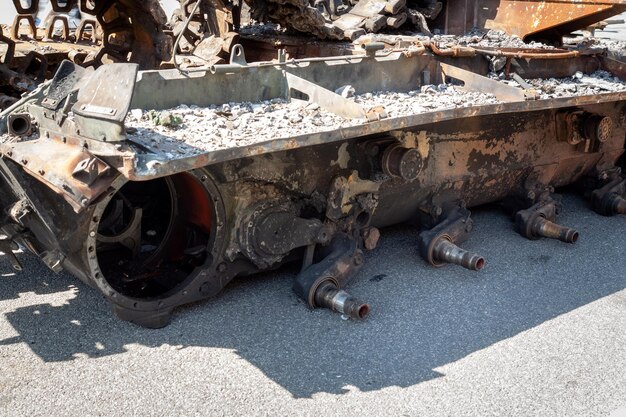 Fragment of a destroyed Russian military tank during the war in Ukraine Chassis without wheels