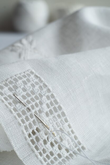 Fragment of hand embroidery by white hemstitch