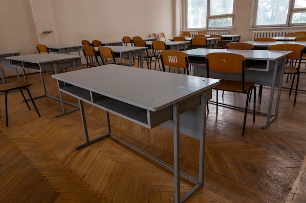 A fragment of the interior of the classroom with desks in an educational institution