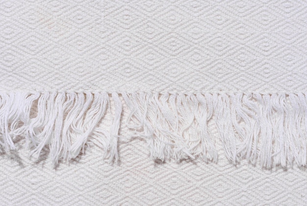 Fragment of a kitchen towel with a fringe