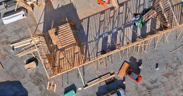 Fragment of a new home under construction wood framing beams framework