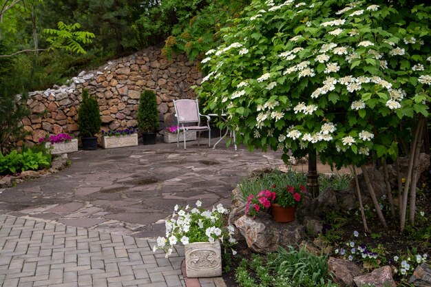 Fragment of the park with garden furniture and plants A place for relaxation in a big city Landscaping