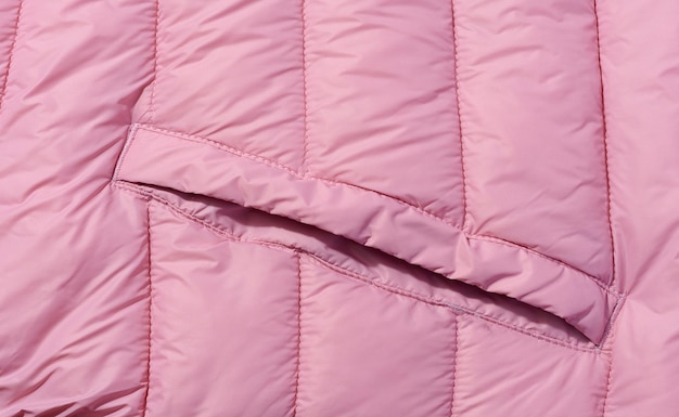 A fragment of pink fabric with down filling and stitching fabric for jackets and coats