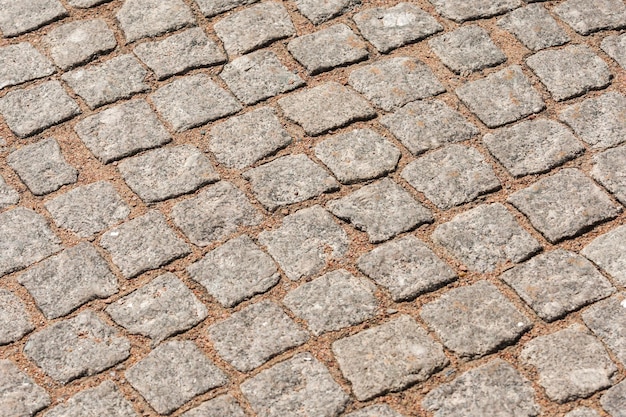 Fragment of a road made of stone in the form of cubes