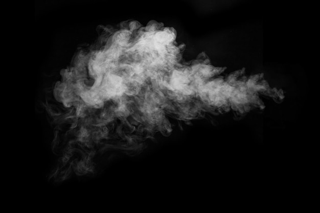 Fragment of white hot curly steam smoke isolated on a black background, close-up. Create mystical Halloween photos. Abstract background, design element