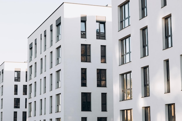 Fragments of facades of modern residential buildings side view closeup