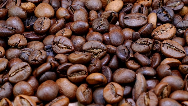 Fragrant roasted dark coffee beans medium roasted coffee beans Selective focus Top view Closeup