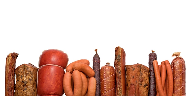 Frame of different sausages isolated on white background top view Meatworks Product Photo