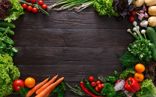 Frame of fresh vegetables on wood with copy space