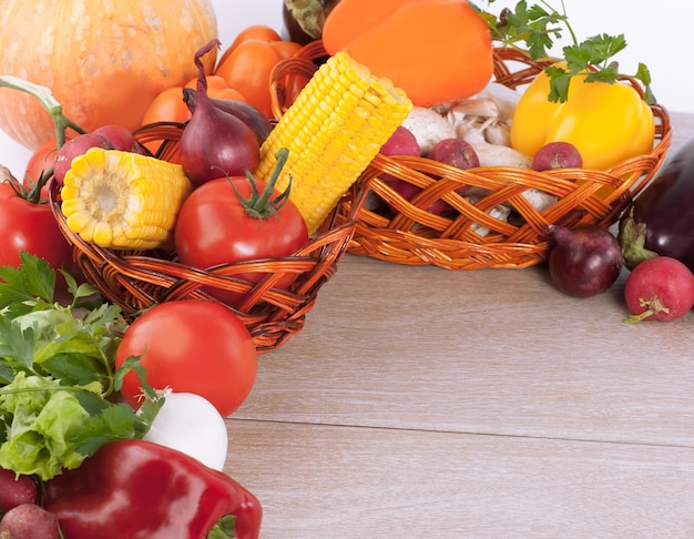 Frame of fresh vegetables on a wooden background