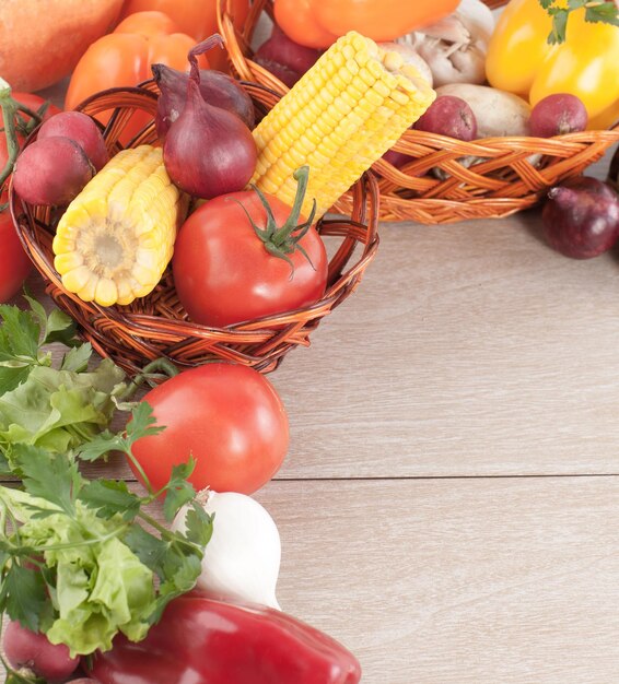 Frame of fresh vegetables on a wooden background