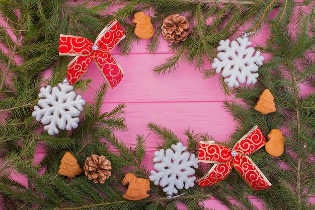 Frame from Christmas tree branches with decorations.