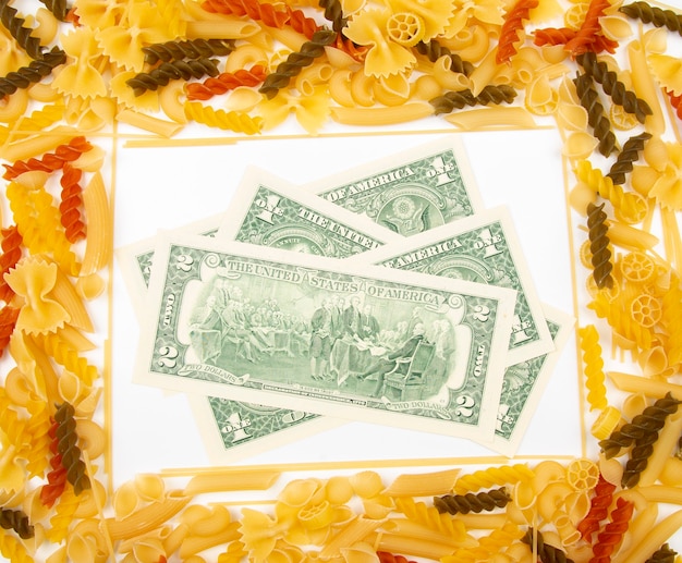 Frame from italian pasta with dollars. flour products and food in cooking